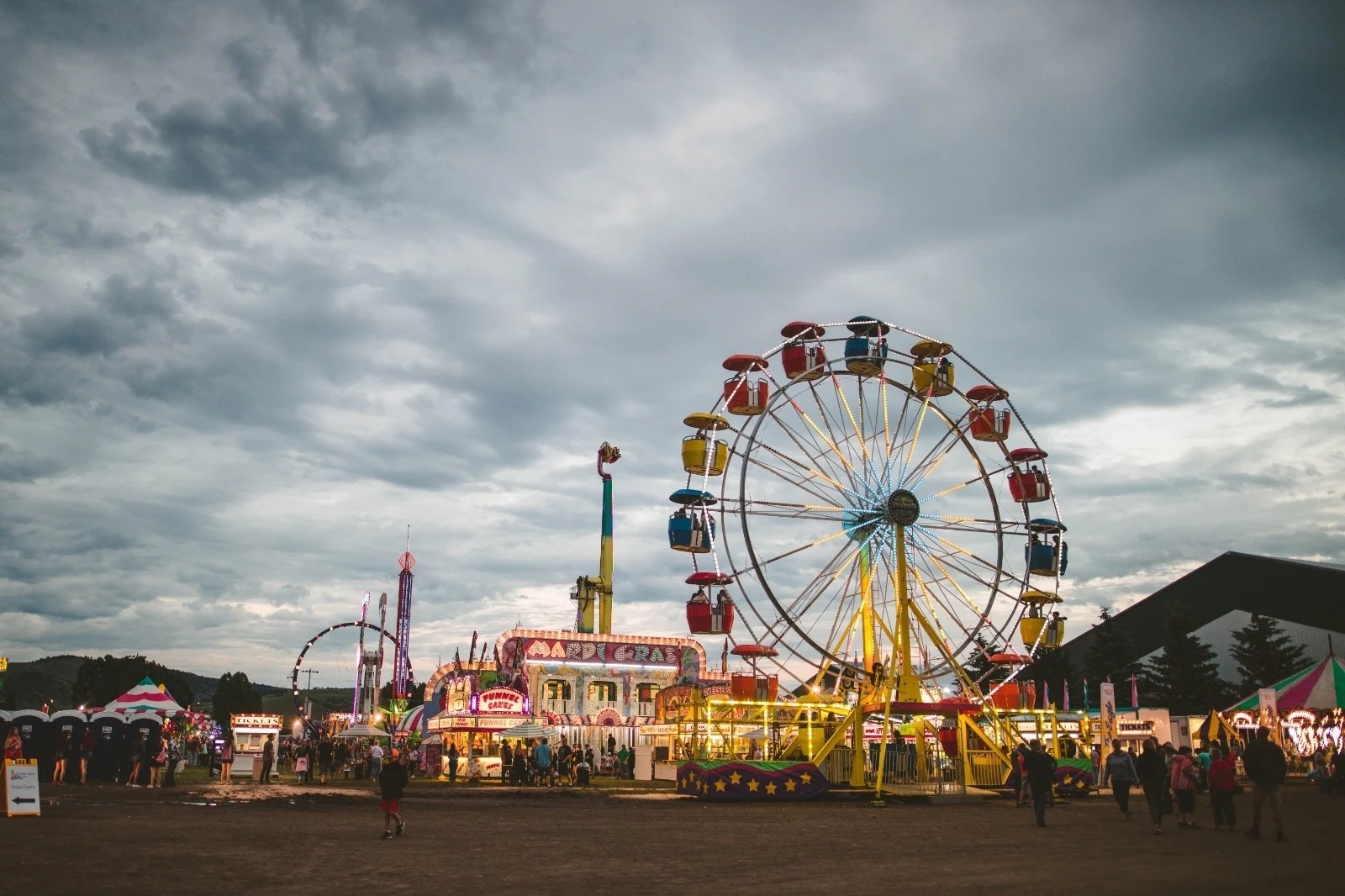 vendors and a ferris wheel at the Gallatin County State Fair