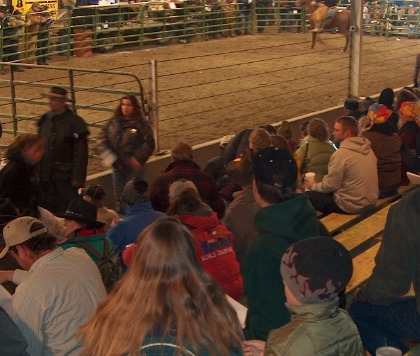 People sitting in the indoor arena